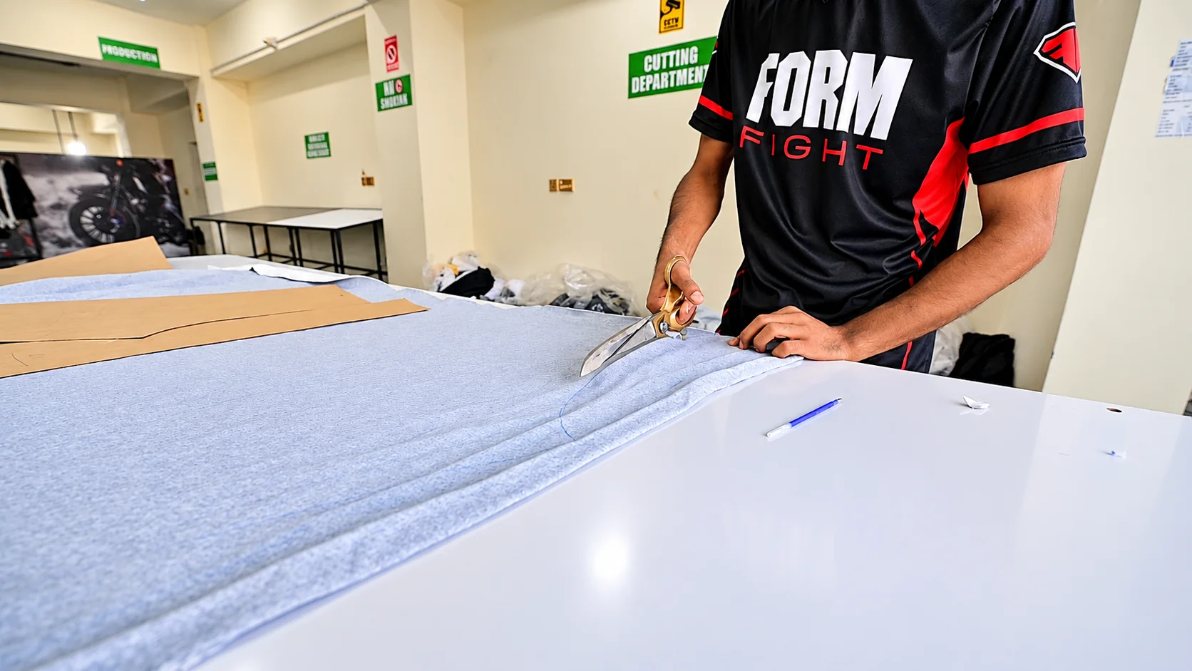 Fabric cutting during garment production at Form Fight
