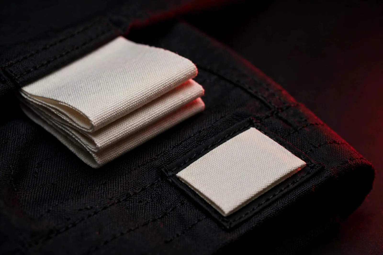 Folded woven labels and a hem tab label close-up